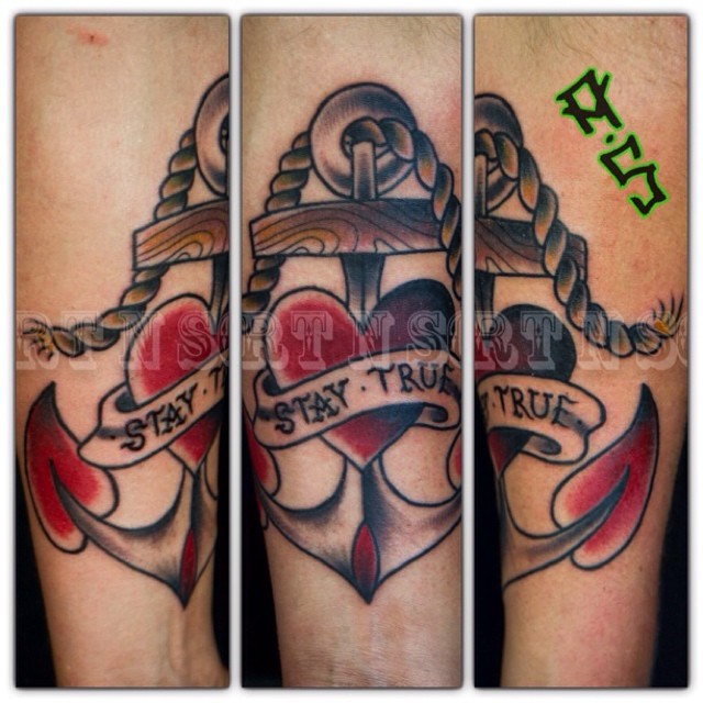 A cool traditional style anchor and heart tattoo by
