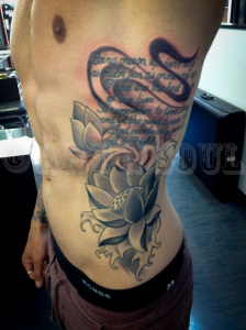 Black and Gray Lotus Rib Tattoo